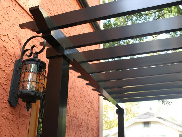 Aluminum Pergolas Black Color Design Beside the Orange House